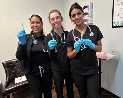 Medical assistants posing for picture between classes